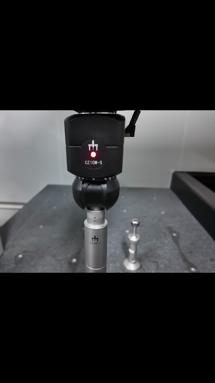 CZ10M-S probe head and SC30 scanning module beside a calibration ball